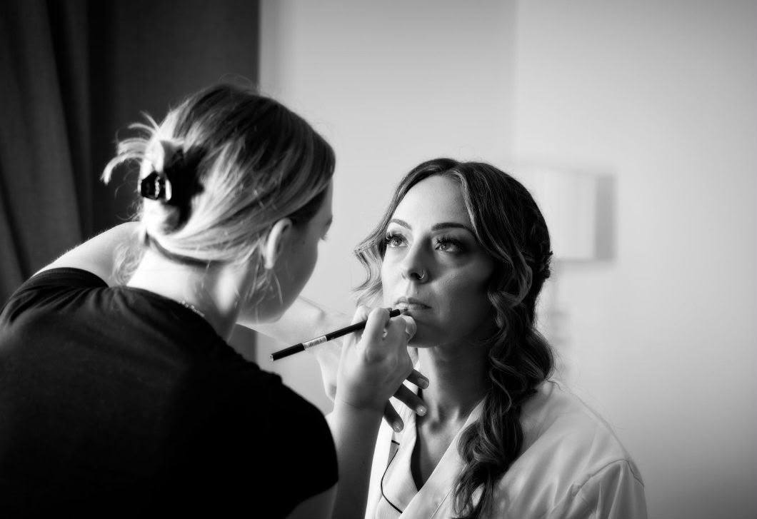 Bridal makeup application by window light