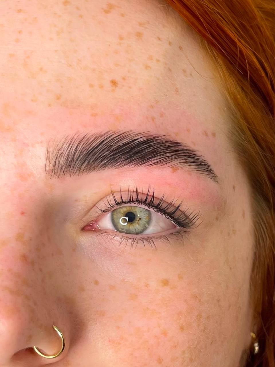 Brow shaping and tint on freckled skin